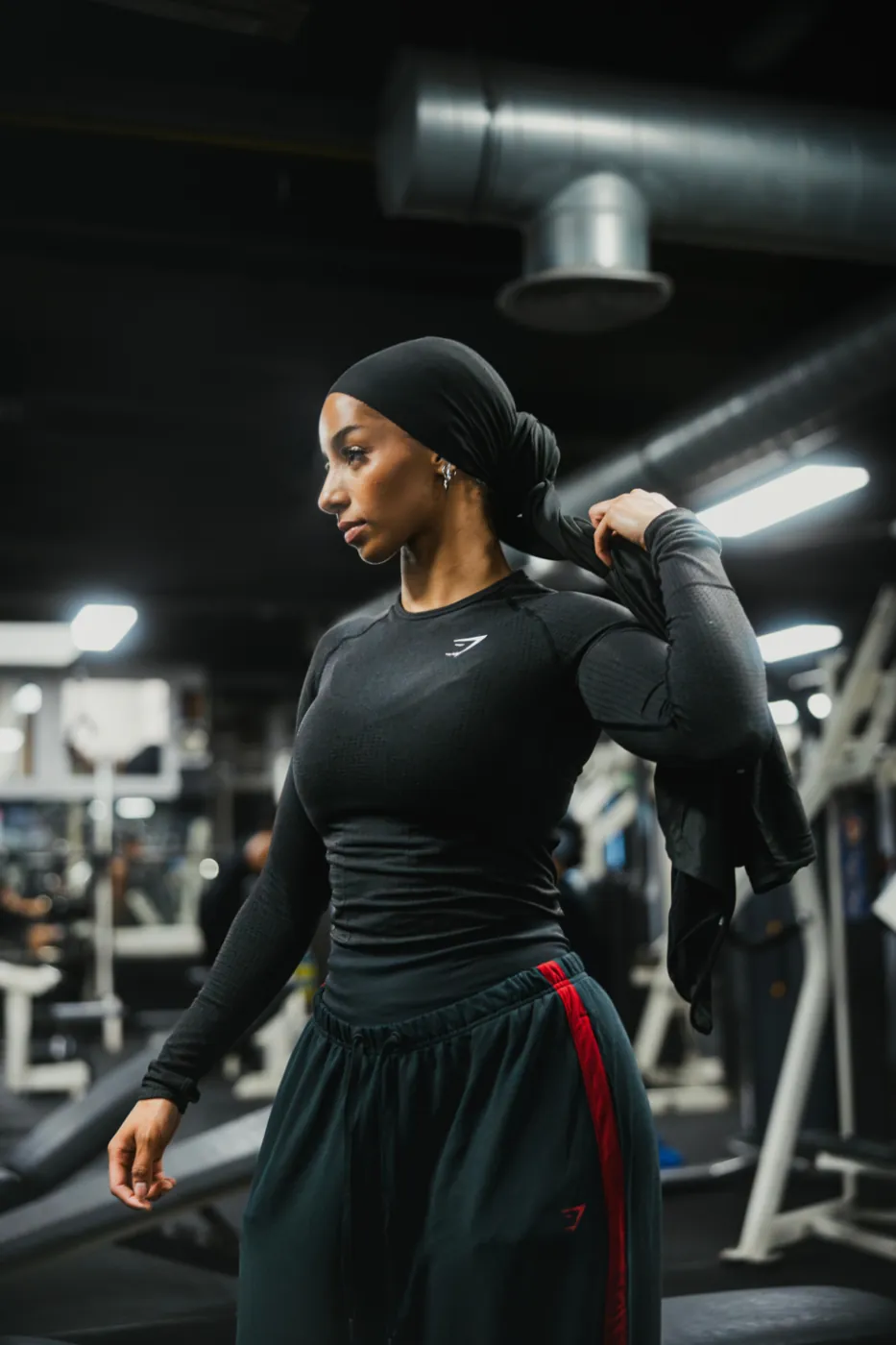 Walking through the gym, towel over the shoulder